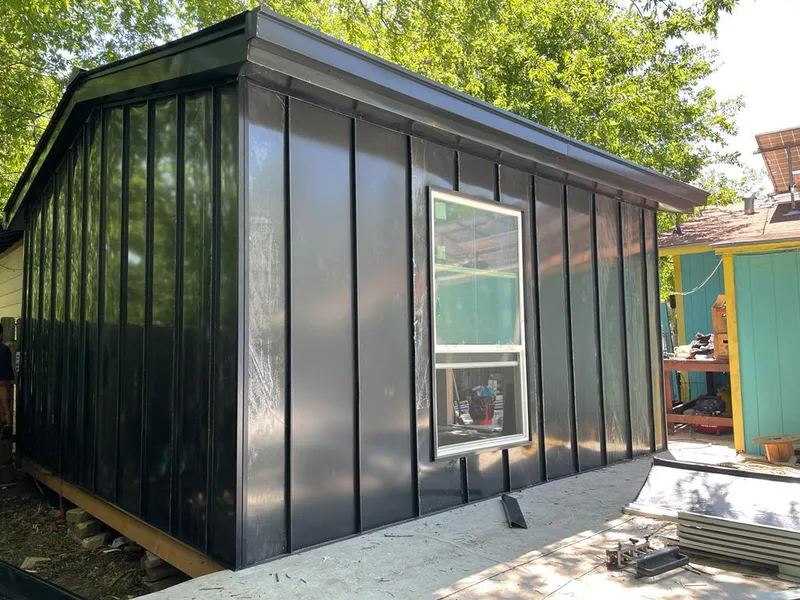 Black standing seam metal wall panels for Roof Inspection in Firestone