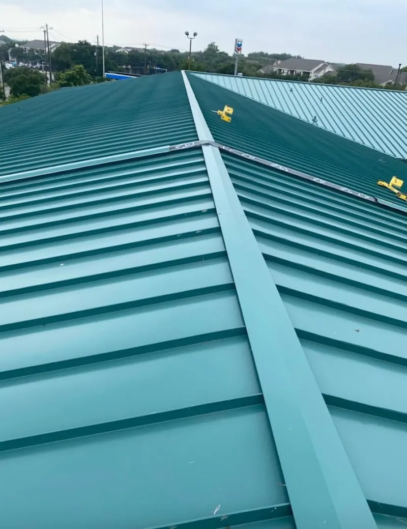 Green commercial metal roof ridge and valley for Metal Roof Repair in Firestone